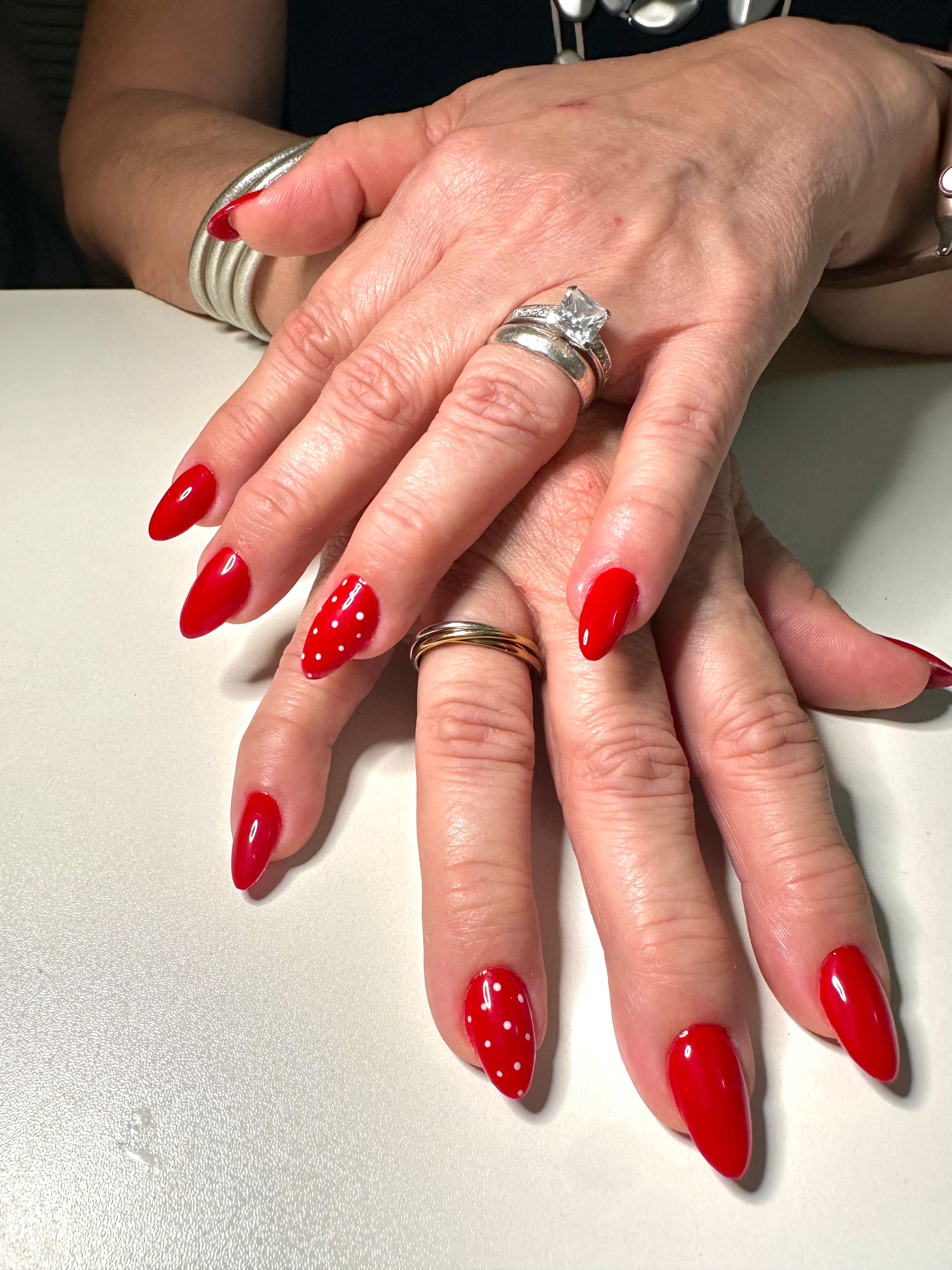 Red and white-polka dots manicure.
